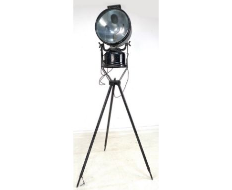 A vintage industrial tripod spotlight lamp, painted black, converted from a paraffin lamp with modern bulb, fitting and cable