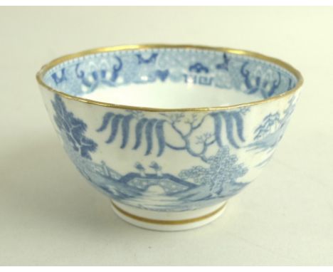 A group of ceramics, comprising an 18th century twisted and fluted tea bowl with gilt highlights, 8.5 by 5cm, a 19th century 