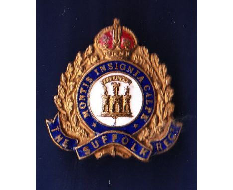 The Suffolk Regiment Sweetheart badge, made of brass with blue, red and white enamel facing. Pin back with KC.