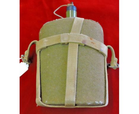 WWII British Issue water flask with original webbing, in good condition for its age with original green felt cover and cork s