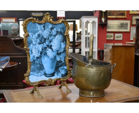 A brass coal scuttle, swing handle; a Rococo style fire screen (2)