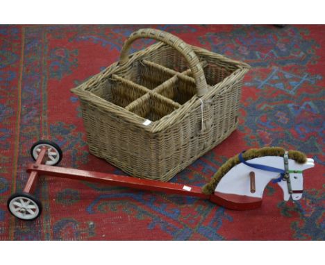A six bottle wicker hamper; a child's hobby horse