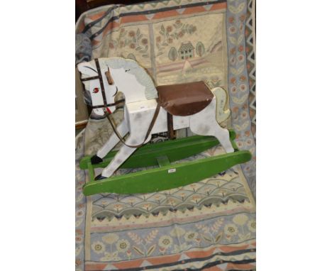 A scratch built rocking horse; a wall hanging tapestry (2)