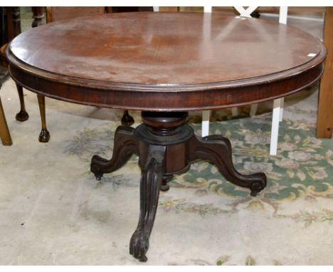 A Victorian mahogany tilt top breakfast table, circular top, cockbeaded frieze, turned column, cabriole legs, ceramic casters