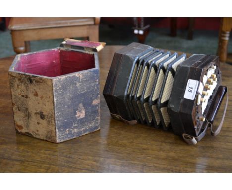 A 21 key squeeze box accordion, fretwoeked ends.