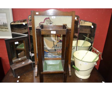 An early 20th century enamel bucket; an oak and nautical woolwork firescreen, c.1930; a shaped bevelled mirror; stand; dressi