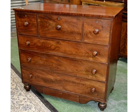 A Victorian flame mahogany chest of drwers, oversailing top, one long and two short cockbeaded drawers over three graduated l