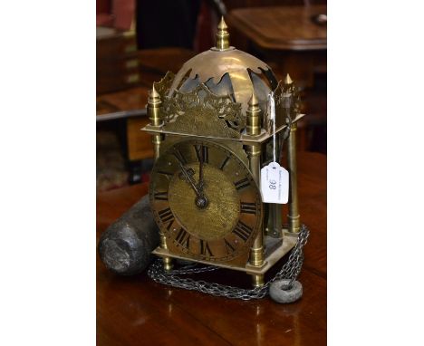 A brass lantern clock