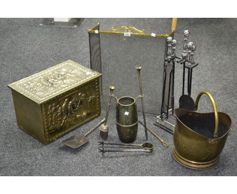 A brass coal bucket; a metal covered log box; a gilt metal companion set; a steel companion set; a brass and mesh fireguard. 
