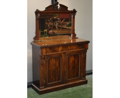 A late Victorian mahogany mirror back sideboard of small proportions, architectural pediment, rectangular plate flanked by fl