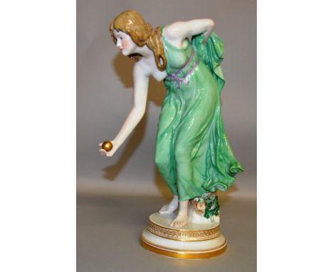 A GOOD MEISSEN MODEL OF A YOUNG LADY BOWLING A BALL and standing on a circular base. 11.5ins high. Cross swords mark in blue.