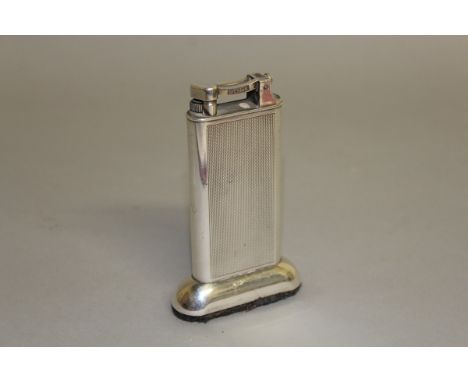 A DUNHILL ENGINE TURNED TABLE LIGHTER. 4ins high. 