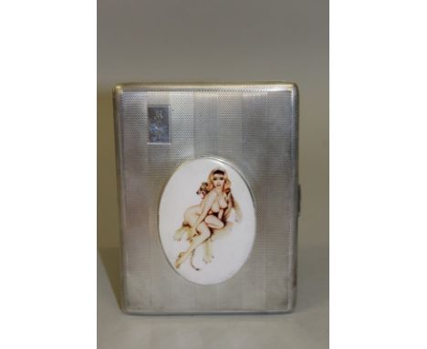 AN ELIZABETH II ENGINE TURNED SILVER CIGARETTE CASE with an oval of a nude. Birmingham 1958. 