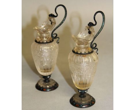 A VERY GOOD PAIR OF VIENNA ROCK CRYSTAL SILVER MOUNTED EWERS with enamel decoration. 6ins high. 