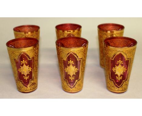 A SET OF SIX GILT ENAMEL RUBY BEAKERS. 