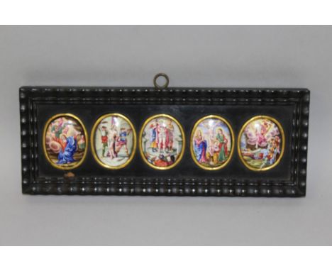 A GOOD SET OF FIVE OVAL ENAMEL PLAQUES, CIRCA. 1860, each with scenes with five stations of the cross.  Each 4cms x 3.5cms, a