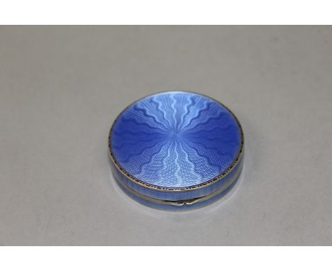 AN ASPREY .925 SILVER AND BLUE ENAMEL CIRCULAR COMPACT. 5cms diameter. 