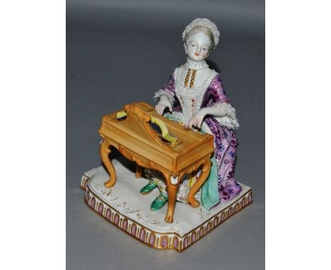 A SMALL MEISSEN GROUP OF A LADY PLAYING A HARPSICHORD, CIRCA. 1860, open music in front of her.  Cross swords mark in blue. 5