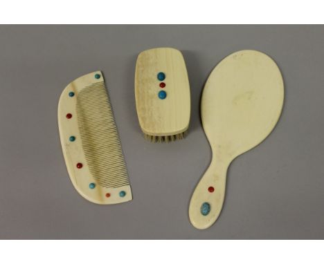 A GOOD 1920’S IVORY HAND MIRROR, LARGE COMB AND BRUSH (3). 