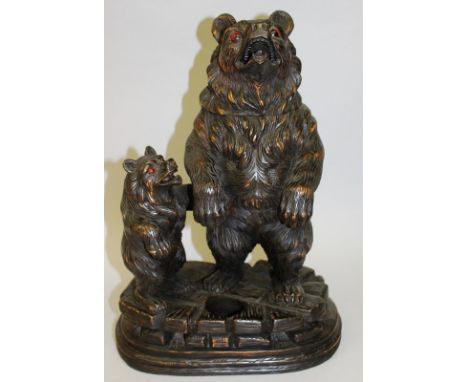 A GOOD 19TH CENTURY BLACK FOREST CARVED BEAR DECANTER STAND formed as a large and small standing bear on a crosshatch base. 1