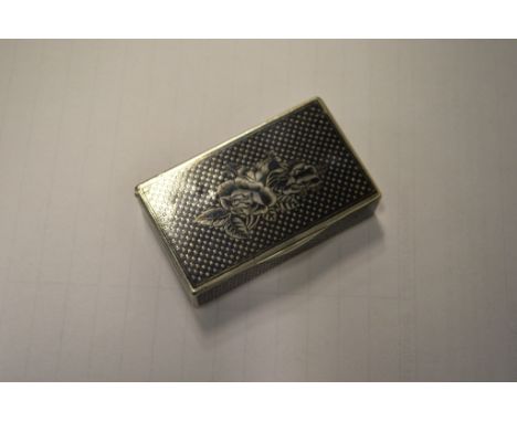 A RUSSIAN SILVER NIELLO RECTANGULAR SNUFF BOX, the lid with a rose. 5.5cms long, 3.5cms wide.