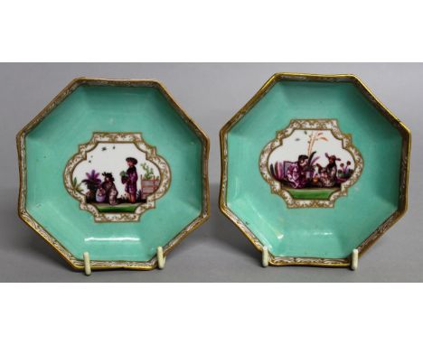 A PAIR OF MEISSEN OCTAGONAL SAUCERS decorated with scenes of Chinese figures. 4.25ins. 