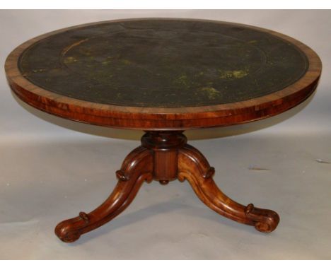A 19TH CENTURY ROSEWOOD CIRCULAR LIBRARY TABLE from WINDSOR CASTLE, ROOM 219, the circular top inset with a leather writing s
