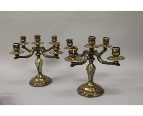 A PAIR OF ST MEDARD PARIS FIVE LIGHT CANDELABRA with four scrolling branches. 10ins high. 