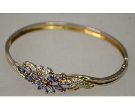A NICE 9ct WHITE GOLD BRACELET set with light blue stones as a flower head. 