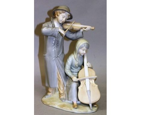 A KPM COPENHAGEN DESIGN GROUP, a man playing a violin and a young woman a cello. 10.5ins high. 