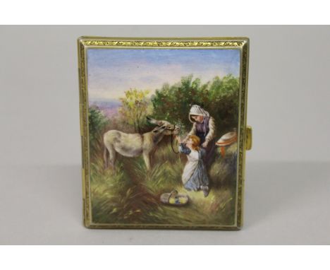AN ENGINE TURNED GILT METAL AND ENAMEL CIGARETTE CASE, CIRCA. 1920, the lid with an enamel, feeding a donkey. 7cms x 8.5cms. 