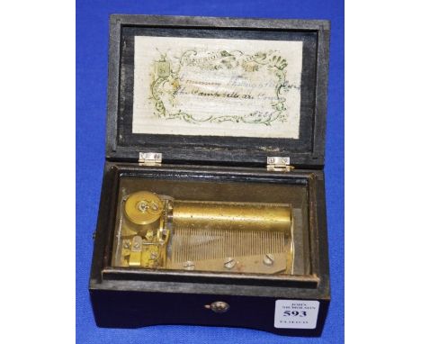 A SMALL SWISS MUSICAL BOX in a mahogany case playing "Coming Through the Rhine" and "The Campbells are Coming". 4.75ins wide.