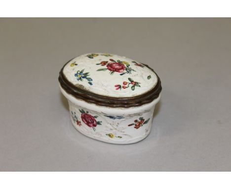 A BILSTON OVAL ENAMEL SNUFF BOX painted with roses. 2.75ins wide. 