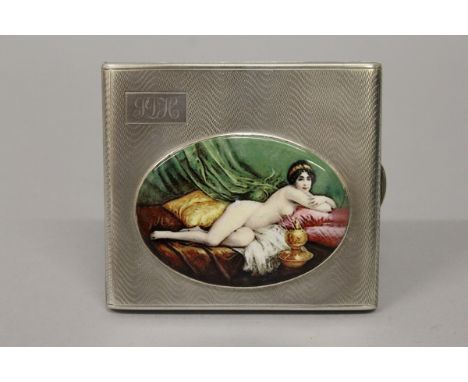 A GEORGE V SILVER ENGINE TURNED CIGARETTE CASE with an oval of a riding nude. Birmingham 1926. 