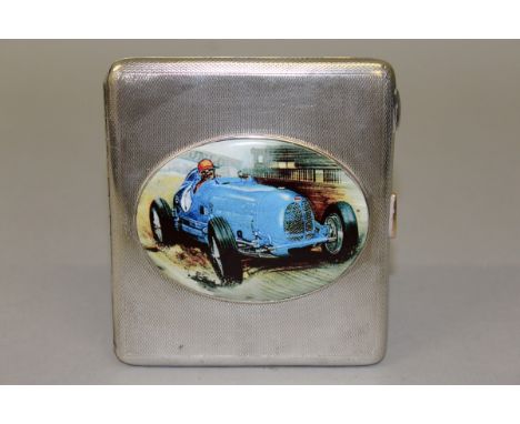 A GEORGE V SILVER ENGINE TURNED CIGARETTE CASE with an oval of a racing car. Birmingham 1928. 