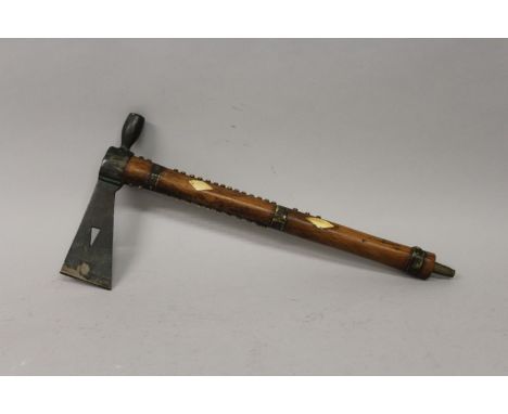 A RARE INDIAN TOMAHAWK WOODEN AND METAL AXE PIPE with diamond cut bone inlay. 17ins long. 