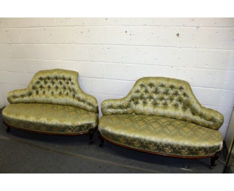 A PAIR OF VICTORIAN WALNUT FRAMED BUTTON UPHOLSTERED LOVE SEATS. 4ft 6ins long.