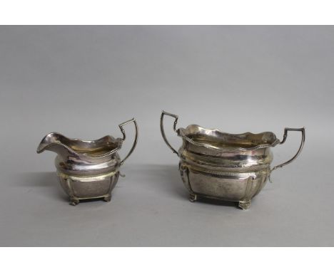 A GEORGE III IRISH TWO HANDLED SUGAR BASIN AND MILK JUG. Dublin 1769. 