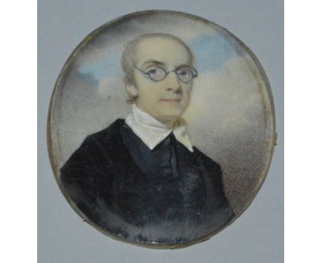 A 19TH CENTURY OVAL PORTRAIT OF A MAN wearing glasses. Ivory Panel 2.5ins x 2ins. 