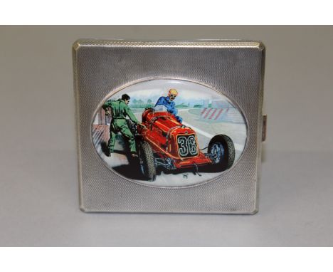 A GEORGE VI SILVER ENGINE TURNED CIGARETTE CASE, the lid with an oval of an old racing car. Birmingham 1938. 