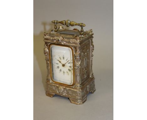 A 19TH CENTURY WHITE METAL CASED CARRIAGE CLOCK. 6ins high. 