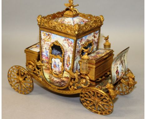 A SUPERB VIENNA ENAMEL CARRIAGE, highly gilded and enamelled on all sides with lift off top, the two coachman seats are in bo