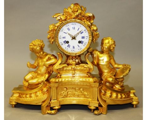 A SUPERB 19TH CENTURY FRENCH GILT ORMOLU CLOCK with eight day movement, white enamel dial with blue and white Roman numerals,