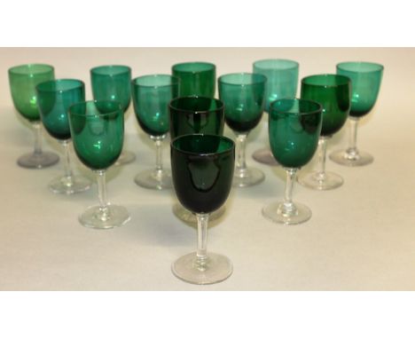 A NEAR MATCHING SET OF THIRTEEN RUBY GLASS WINE GLASSES. 