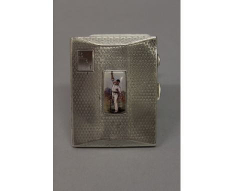 A GEORGE V SILVER ENGINE TURNED CIGARETTE CASE with an oval of a cricketer. Birmingham 1926. 