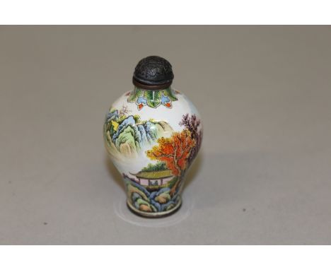 A CANTON ENAMEL SNUFF BOTTLE decorated with a landscape scene. 2.75ins high. 