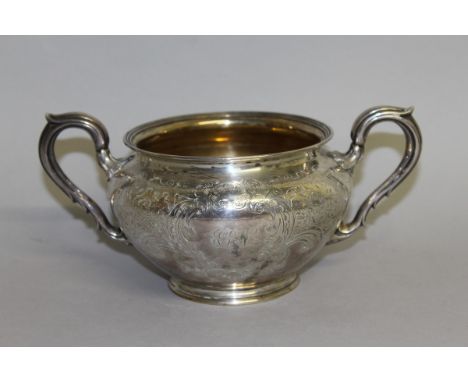 A VICTORIAN TWO HANDLED CIRCULAR SUGAR BASIN with engraved decoration. London 1852. Maker W. K. K.  Weight 11ozs. 