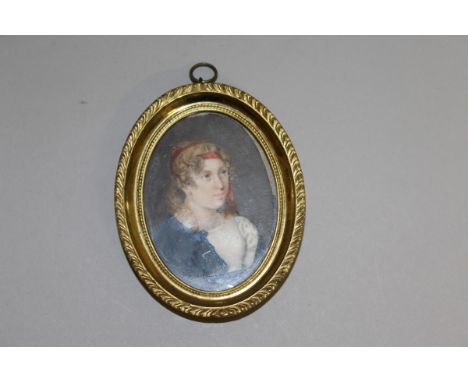 AFTER BOILLEY A VICTORIAN OVAL PORTRAIT of a YOUNG LADY with red hair band. 2.5ins x 1.75ins, in a gilt oval frame. 