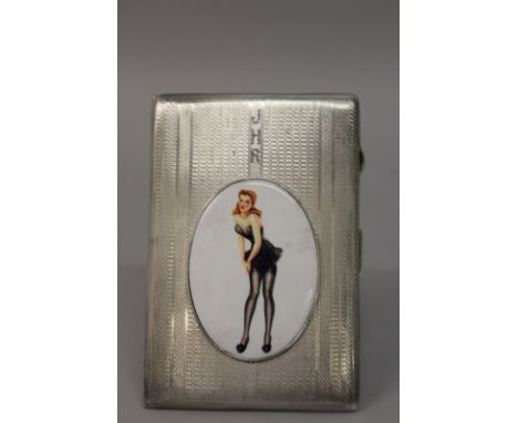 A LARGE GEOGE VI ENGINE TURNED CIGARETTE CASE, the lid with an oval of a young lady adjusting her stockings. Birmingham 1946.