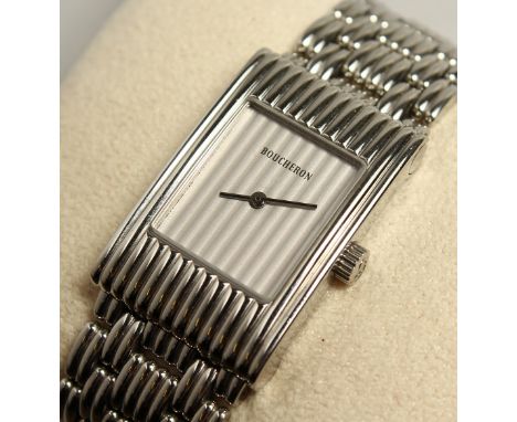A BOUCHERON STEEL WRIST WATCH AND BRACELET. No. AK 416582.